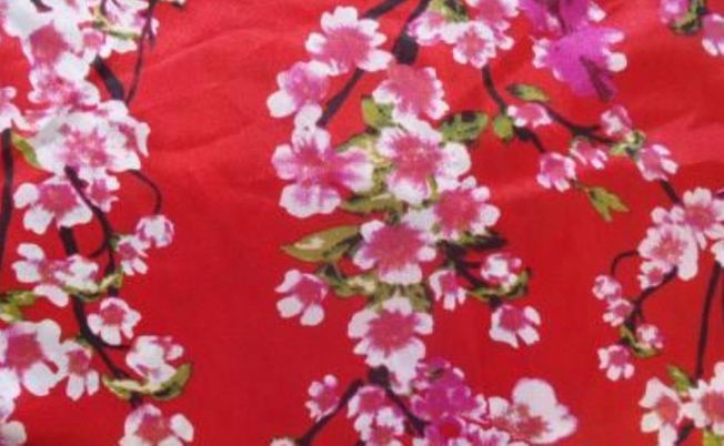 Red fabric with pink cherry blossom 