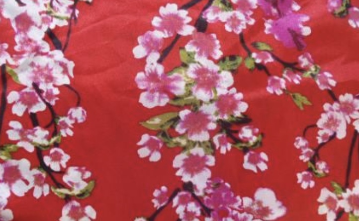 Red fabric with pink cherry blossom 