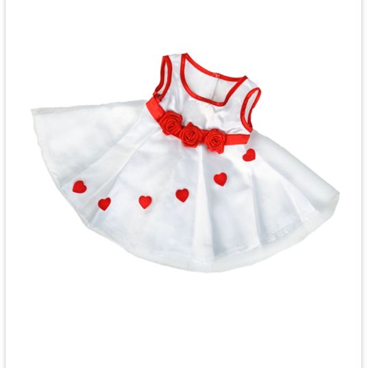Red hearts on white princess dress.
